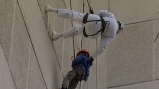Pensioner abseils building