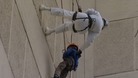 Pensioner abseils building