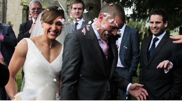 Well-wishers throw confetti at Jessica Ennis and her new husband, Andy Hill.