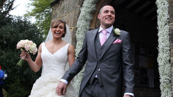 Jessica Ennis and Andy Hill pose for the waiting media.
