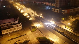 Explosives go off as the viaduct collapses during a controlled demolition in Wuhan, Hubei province