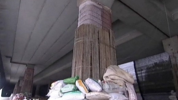 The piers supporting the viaduct were wrapped with cotton, wires and sand bags 