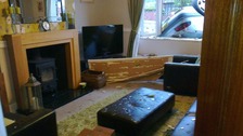 Man dies as car overturns and hits house