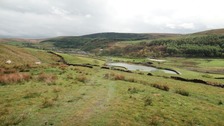 Cloudy skies over hills of Burnley.