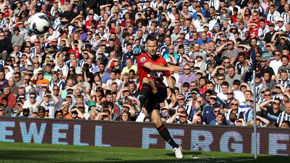 Manchester United's Ryan Giggs takes a corner kick during the game against West Brom.