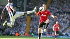 West Bromwich Albion's Youssouf Mulumbu and Manchester United's Alexander Buttner (right) battle for the ball