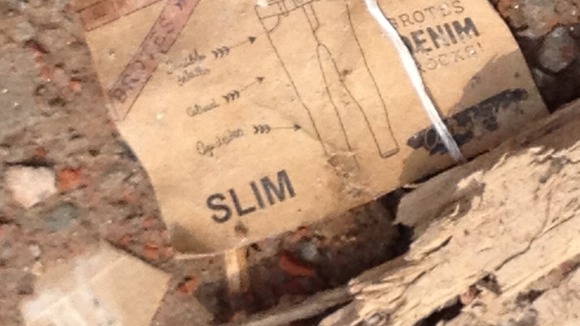 A label from a Western retailer among the rubble of the remains of the garment factory.