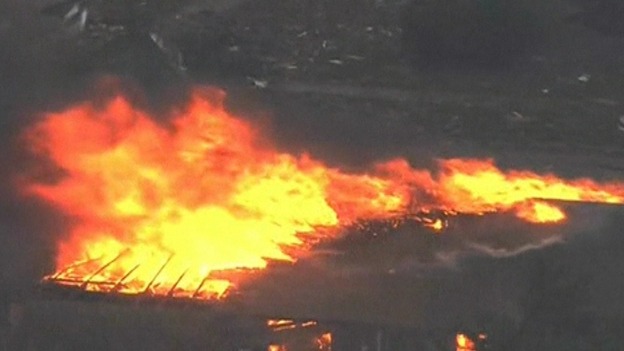 Aerial footage shows fires and flattened buildings after the tornado tore through
