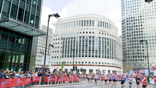 Charity donations replace share prices on the Thomson Reuters LCD ticker tape in Canary Wharf