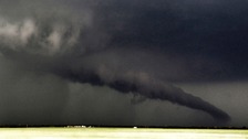 A giant funnel cloud almost makes landfall near South Haven in Kansas