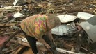Woman's joy at finding her missing dog in the rubble