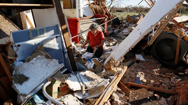 Charles Maloney tries to salvage papers from his tornado-destroyed home on Heather Lane in Moore.