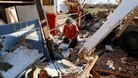 Oklahoma survivors pick through the rubble