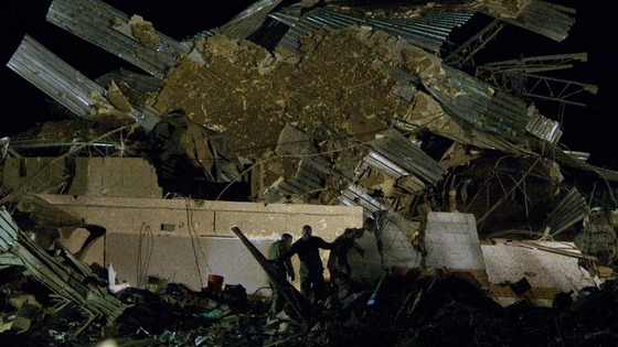 Rescue personnel combs through the pile of rubble that was once Plaza Towers Elementary School.