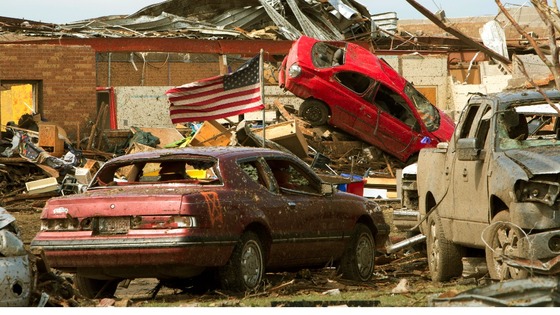 Destroyed vehicles lie in the rubble outside the Plaza Towers Elementary school in Moore, Oklahoma.