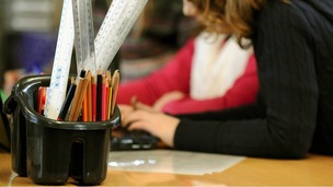 Primary school children at work in a classroom