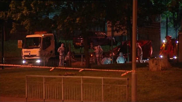 Forensic teams move the car from the scene in Woolwich.