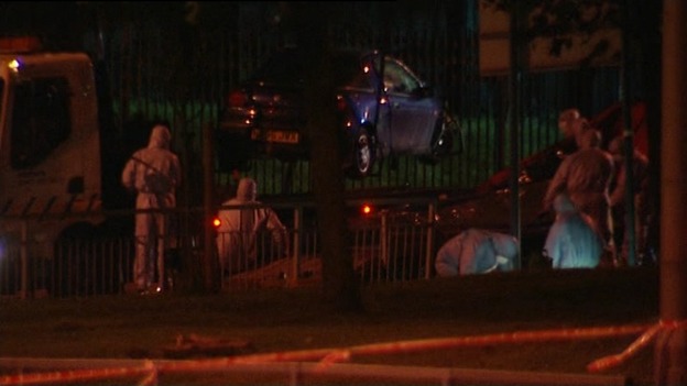 Forensic teams move the car from the scene in Woolwich.