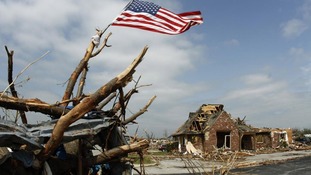 Residents are returning to try and salvage their possessions from the wreckage.