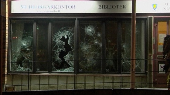 Shop windows were smashed in a fifth night of unrest.