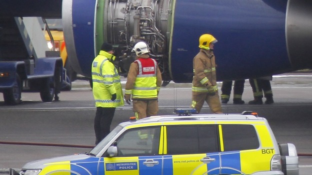 A British Airways plane surrounded by emergency vehicles after it had to make an emergency landing at Heathrow Airport.