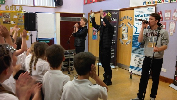 District 3 perform songs for competition-winning Victoria Junior school.