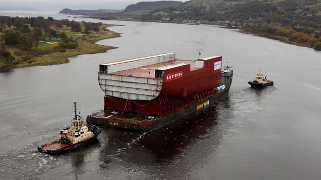 A section of a new Royal Navy aircraft carrier is transported through the Firth of Forth