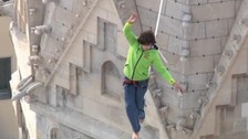 Daredevil walks tightrope across famous landmark