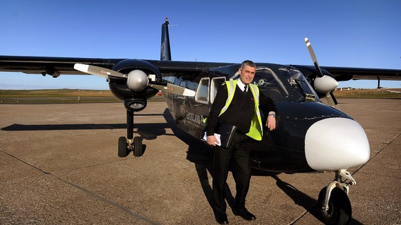 Stuart Linklater with his Islander aircraft