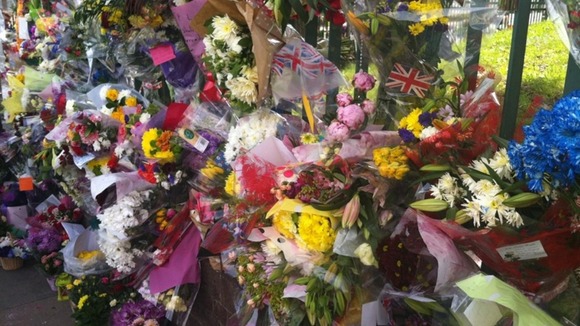 Hundreds of flowers left near Woolwich Barracks