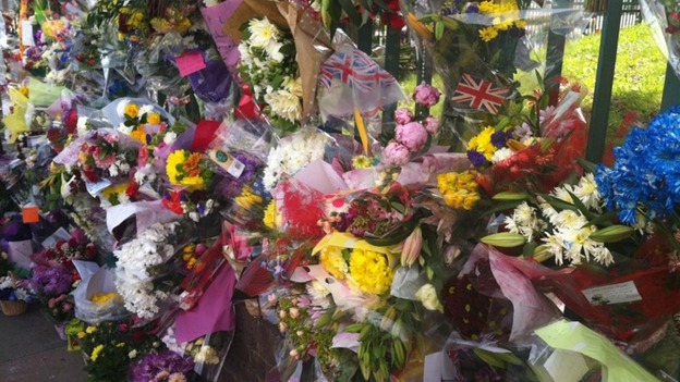 Hundreds of flowers left near Woolwich Barracks