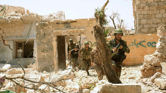 Forces loyal to Syria's President Bashar al-Assad seen during an operation in Aleppo