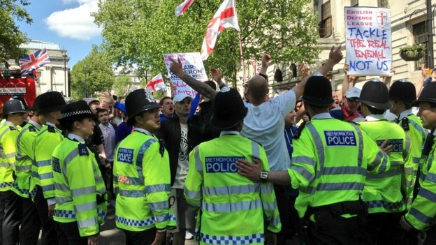 Police and protesters during a protest in central London