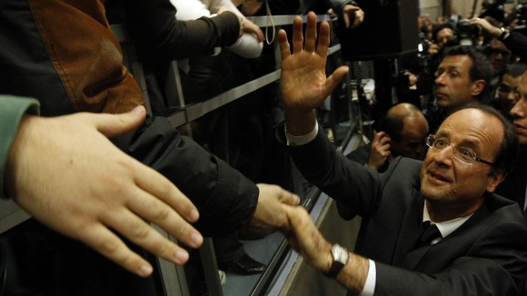 Socialist Party candidate for the presidential election Francois Hollande greets supporters