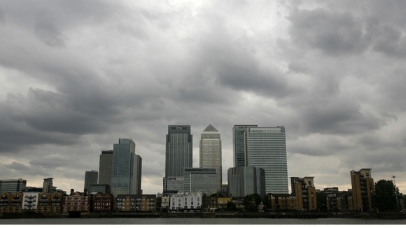 Storm clouds are seen above the Canary Wharf financial district