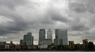 Storm clouds are seen above the Canary Wharf financial district
