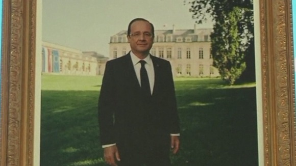 The portrait of President Francois Hollande that stands close to where the couple will tie the knot
