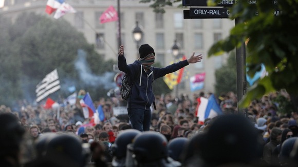 A protester taunts riot police during the 'La Manif pour Tous' (Demonstration for All) against same-sex marriage in Paris