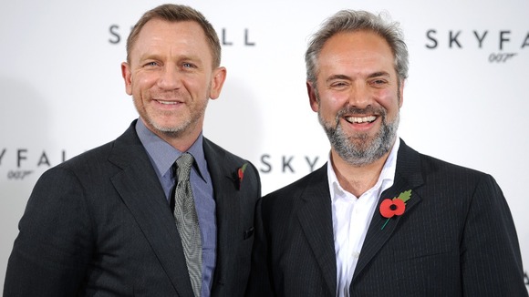 Director Sam Mendes (R) with Daniel Craig at a photocall for Skyfall, in London