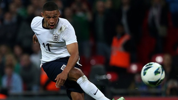 Alex Oxlade-Chamberlain misses a great, late chance for home side England