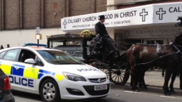 The cortege arrives at the Calvary Church of God in Christ for the funeral of 46 yr old Paul Foster
