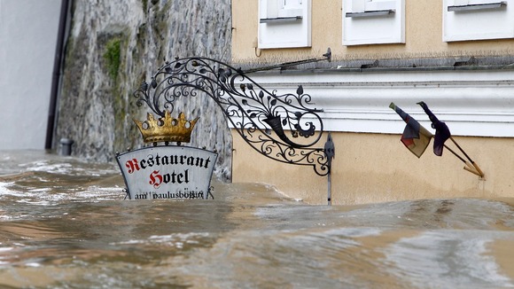 The floodwater has reached the level of this restaurant sign in one part of the town