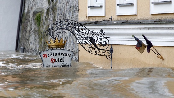 The floodwater has reached the level of this restaurant sign in one part of the town