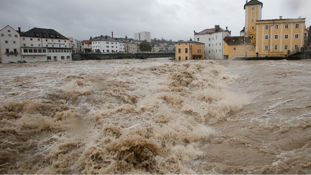 Flooded houses next to river Steyr are pictured during heavy rainfall in the small Austrian city of Steyr