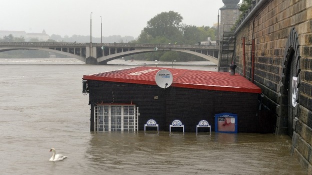 A restaurant at flooded riverside is seen in centre of Prague.