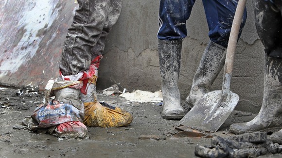 Plastic bags being used to protect feet from the flood waters