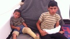 Ahmad, 4, and his brother Mohammad, 14, were wounded when a shell hit their kitchen in Deraa