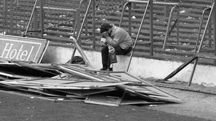 Liverpool fan sitting on the terraces at Hillsborough after the stadium disaster