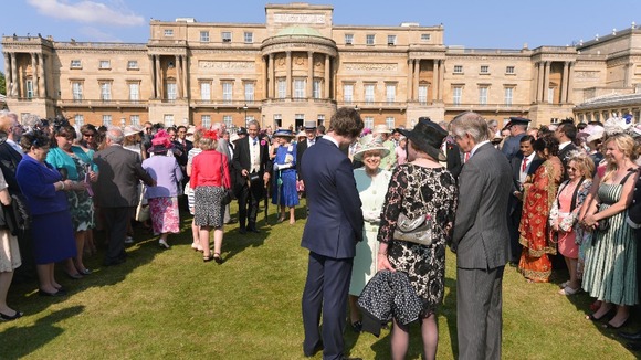 Queen Elizabeth II meets guests at a Garden Party at Buckingham Palace