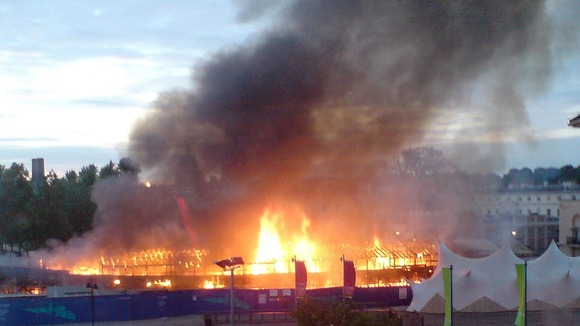 A fire burns on board the clipper boat The Cutty Sark on May 21, 2007